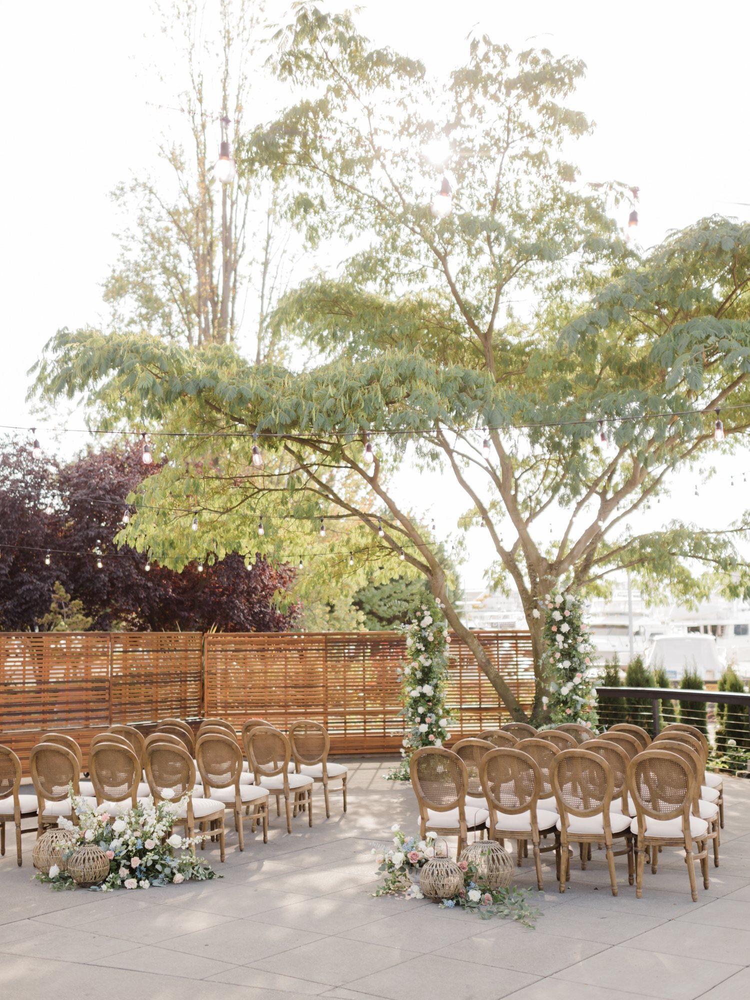 Outdoor ceremony aisle with a floral arbor